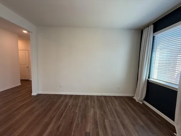 a view of wooden floor and brick walls