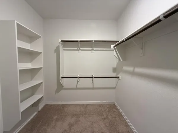 a view of an empty walk in closet