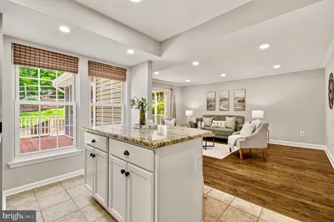a kitchen with stainless steel appliances granite countertop a stove and a refrigerator