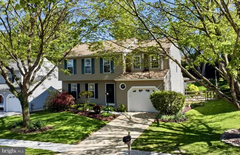 front view of a house with a garden