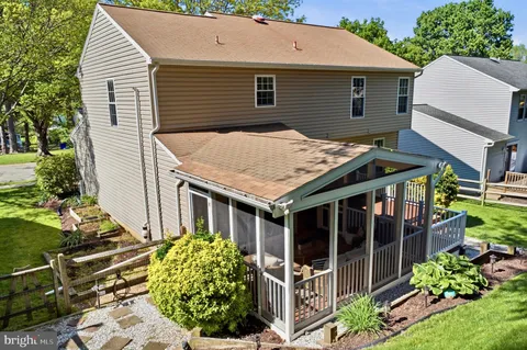 an aerial view of a house with a yard and garden