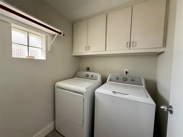 a bathroom with a toilet a sink and a mirror