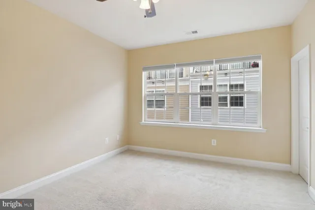 a view of empty room with windows