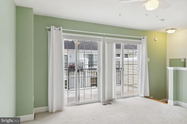 a view of empty room with floor to ceiling window