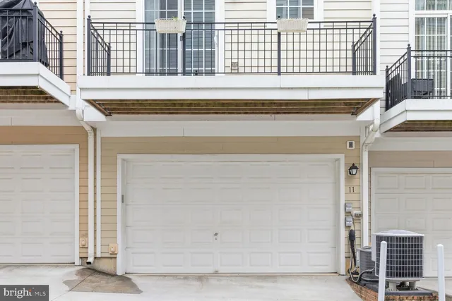 a view of front door of house with wooden stairs