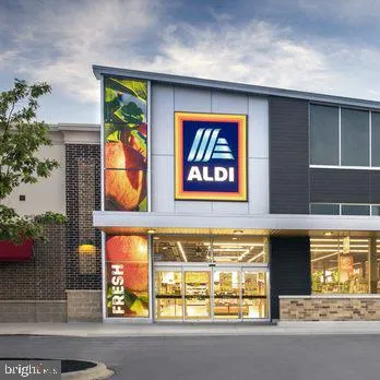 a front view of a building with glass windows and door