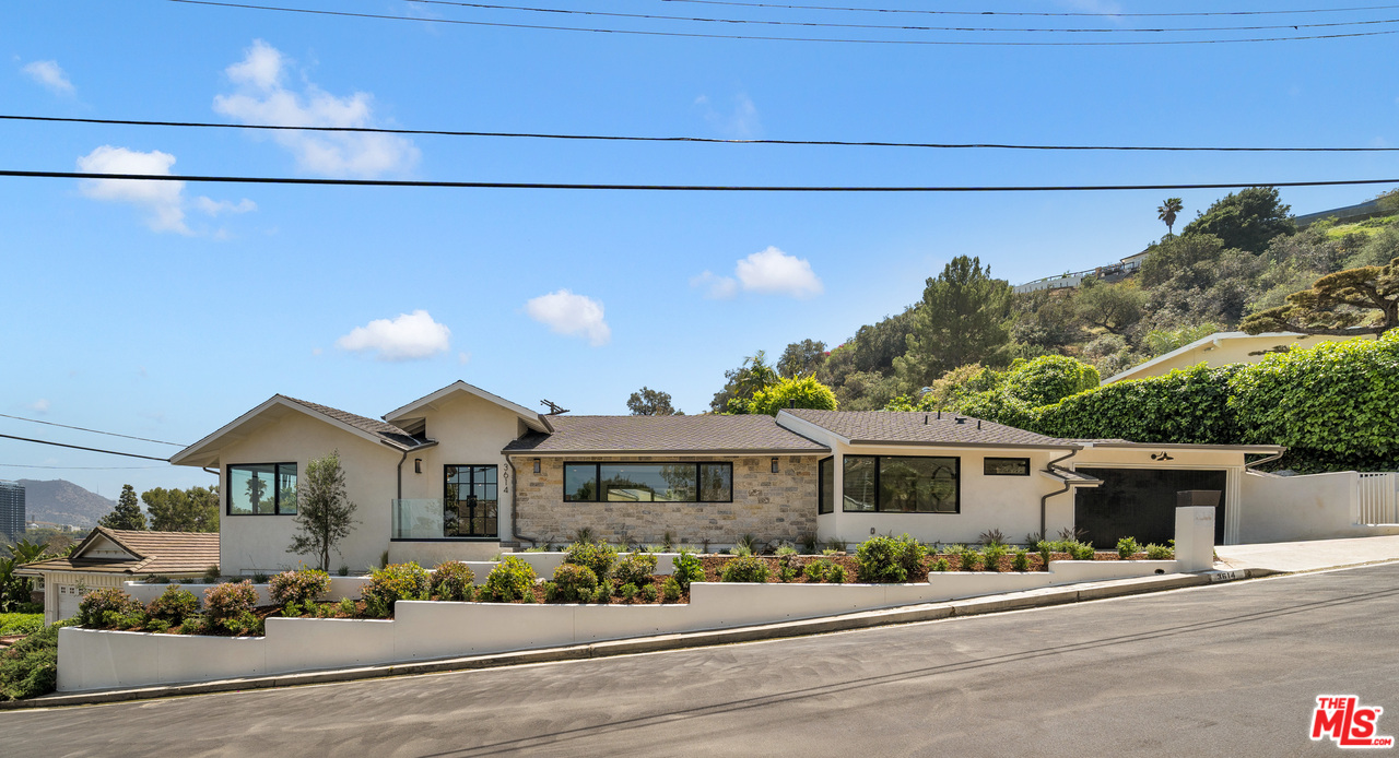 3614 Willowcrest Avenue Studio City, CA 91604 - Photo 2 of 43 a front view of a house with a street