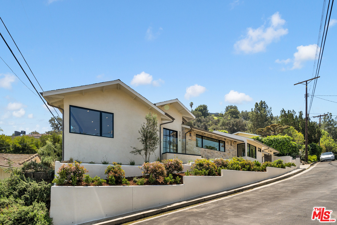 3614 Willowcrest Avenue Studio City, CA 91604 - Photo 3 of 43 a front view of a house with a yard