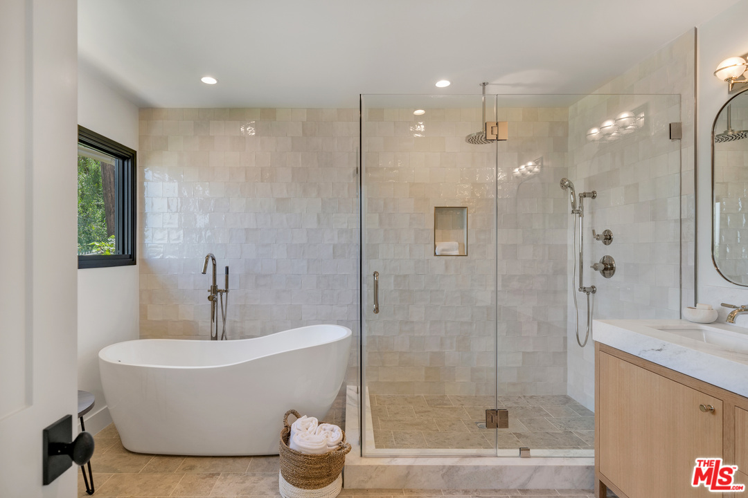 3614 Willowcrest Avenue Studio City, CA 91604 - Photo 25 of 43 a white bath tub sitting next to a bathroom