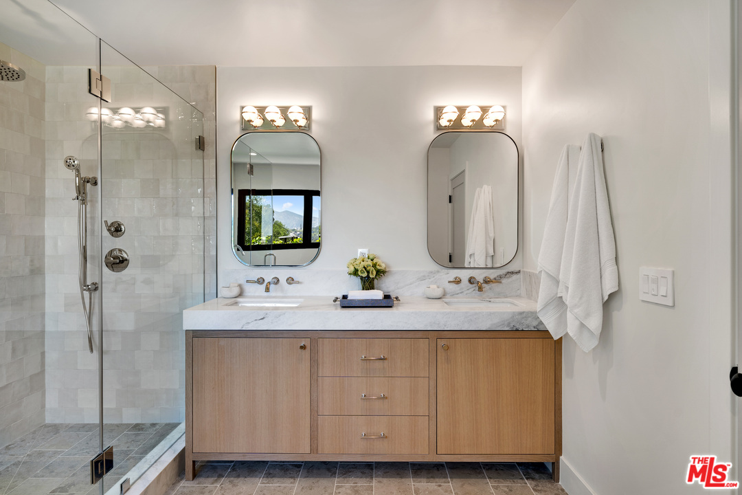 3614 Willowcrest Avenue Studio City, CA 91604 - Photo 26 of 43 a bathroom with double sink and a mirror