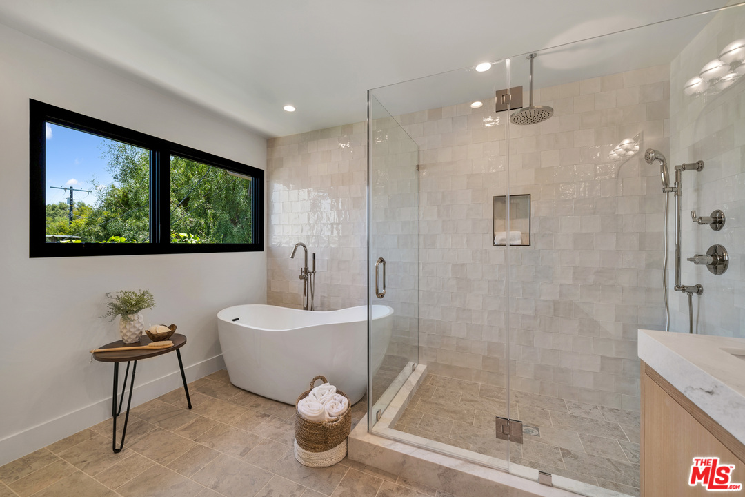 3614 Willowcrest Avenue Studio City, CA 91604 - Photo 28 of 43 a bathroom with a bathtub and a shower
