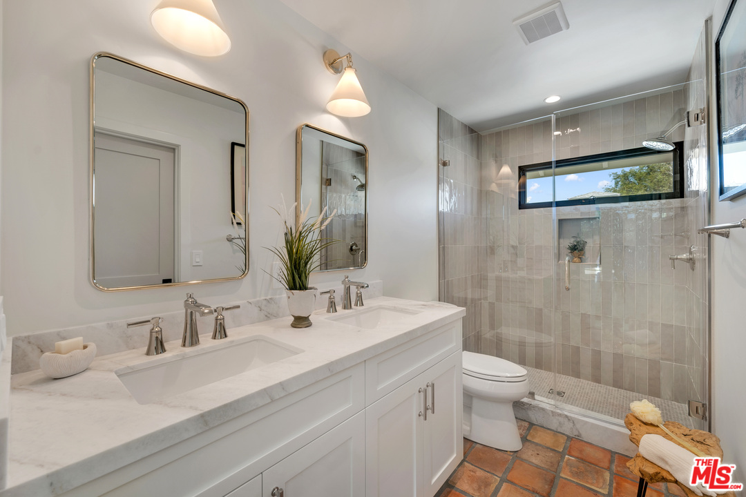 3614 Willowcrest Avenue Studio City, CA 91604 - Photo 31 of 43 a bathroom with a sink a toilet and shower