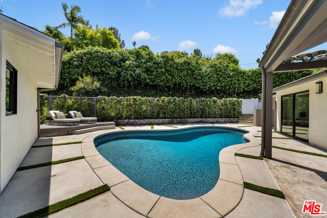 3614 Willowcrest Avenue Studio City, CA 91604 - Photo 37 of 43 a view of a swimming pool with a patio