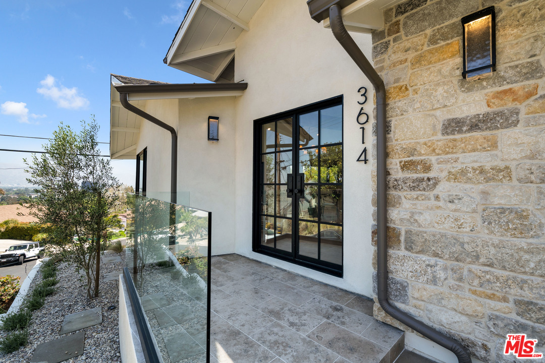 3614 Willowcrest Avenue Studio City, CA 91604 - Photo 6 of 43 a view of a porch with a table and chairs