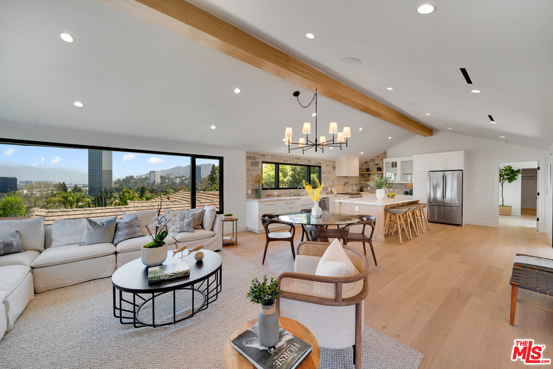 3614 Willowcrest Avenue Studio City, CA 91604 - Photo 9 of 43 a living room with fireplace furniture and a large window
