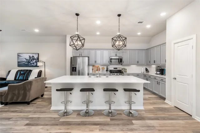a view of living room with granite countertop furniture and kitchen view