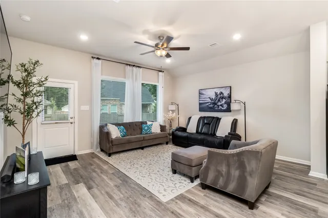 a living room with furniture and a large window