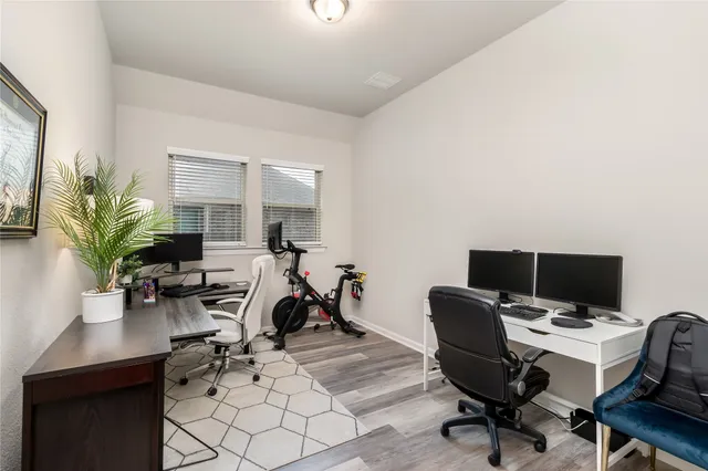 a view of a workspace with furniture