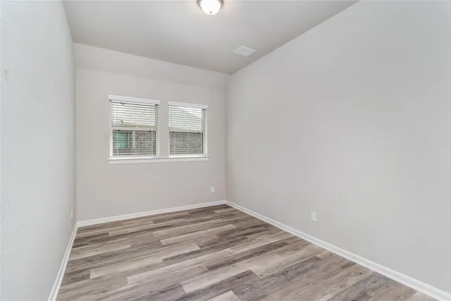 a view of a room that has a window in it