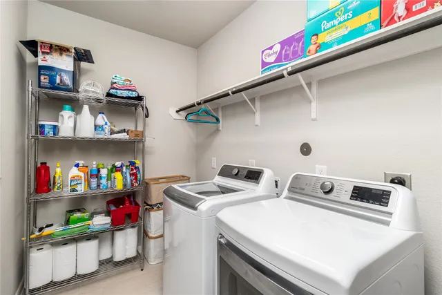 a utility room with washer and dryer