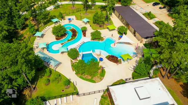 a backyard of a house with a yard and outdoor seating