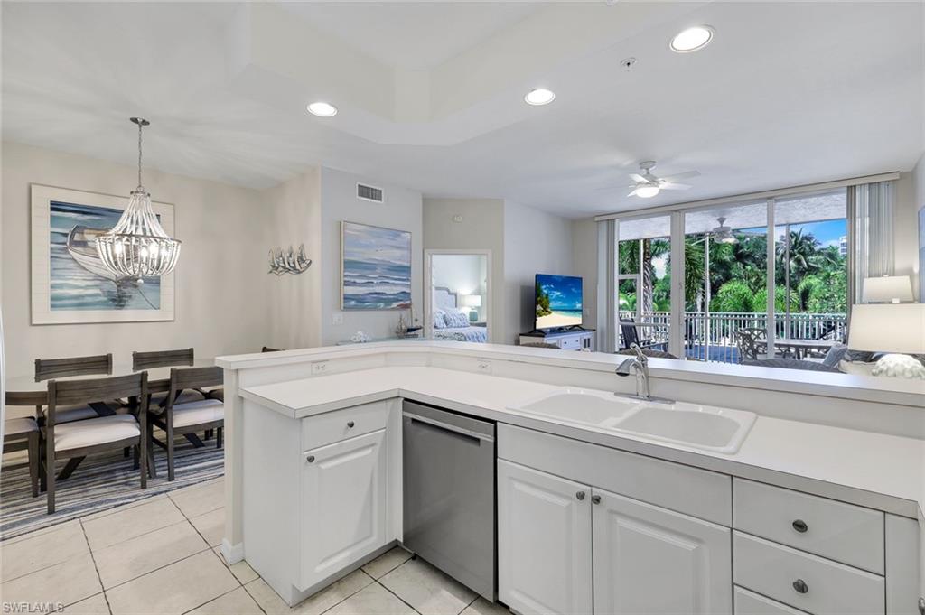 460 Launch Circle, Unit 202 Naples, FL 34108 - Photo 7 of 34 a kitchen with sink and window