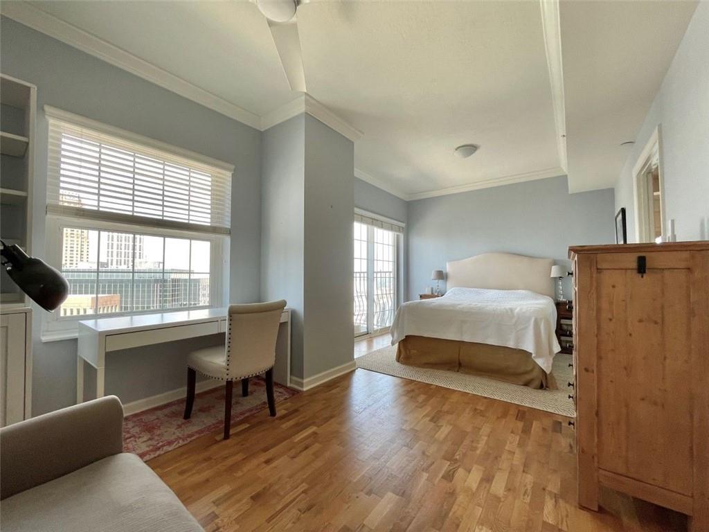 195 14th Street Northeast, Unit P603 Atlanta, GA 30309 - Photo 12 of 27 a bedroom with a bed and a large window