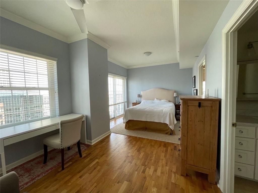 195 14th Street Northeast, Unit P603 Atlanta, GA 30309 - Photo 13 of 27 a bedroom with a bed and a window