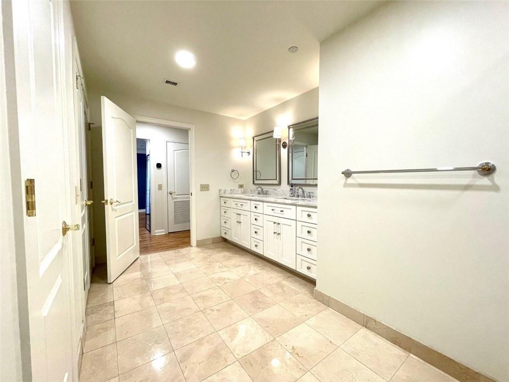 195 14th Street Northeast, Unit P603 Atlanta, GA 30309 - Photo 16 of 27 a view of a bathroom with a shower and a sink