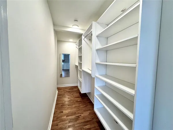 a hallway view with wooden floor
