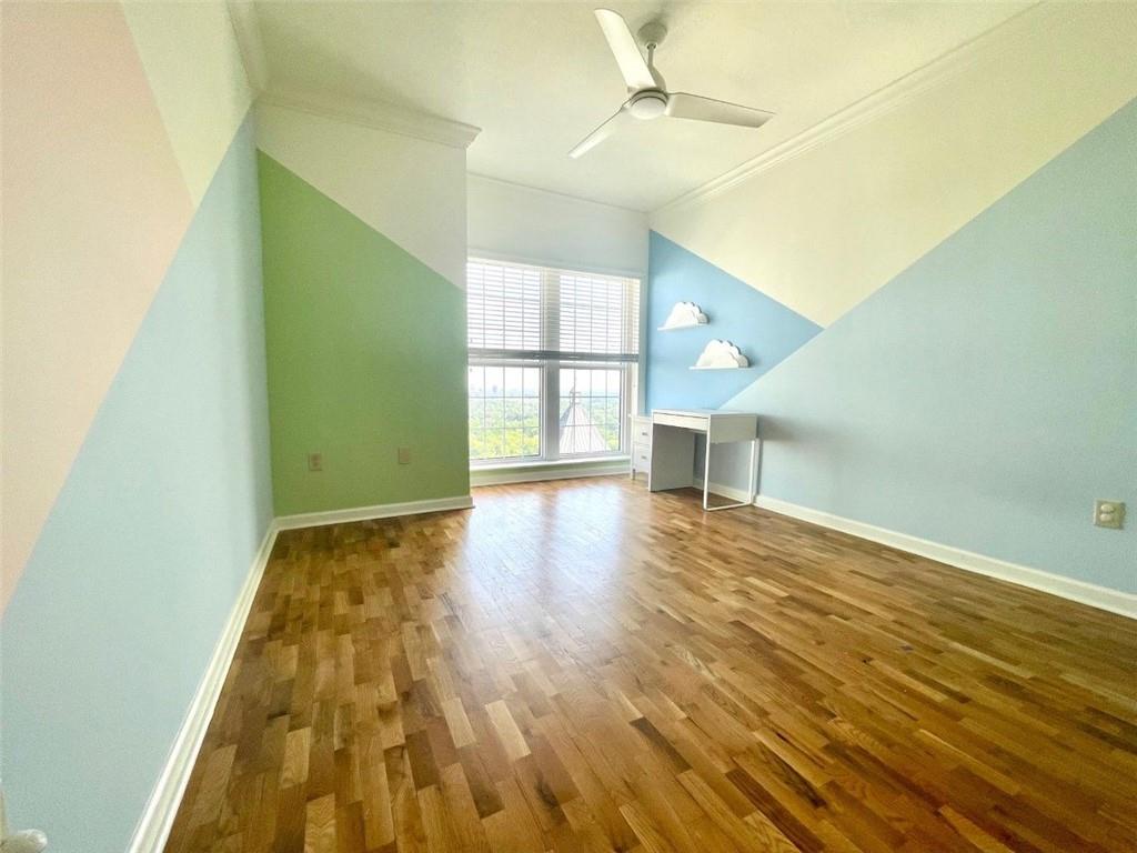 195 14th Street Northeast, Unit P603 Atlanta, GA 30309 - Photo 20 of 27 a view of empty room with wooden floor and fan