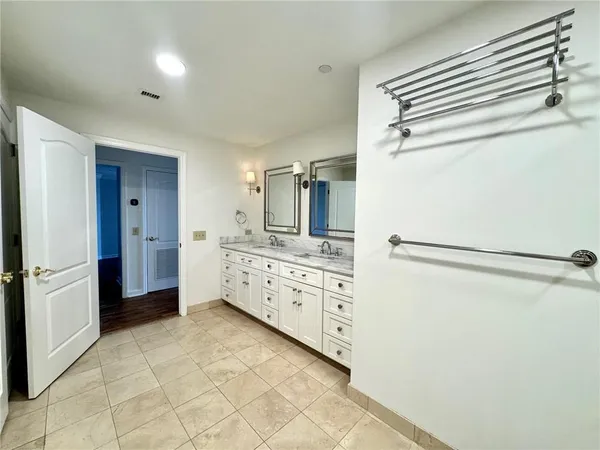 a kitchen with granite countertop cabinets and refrigerator