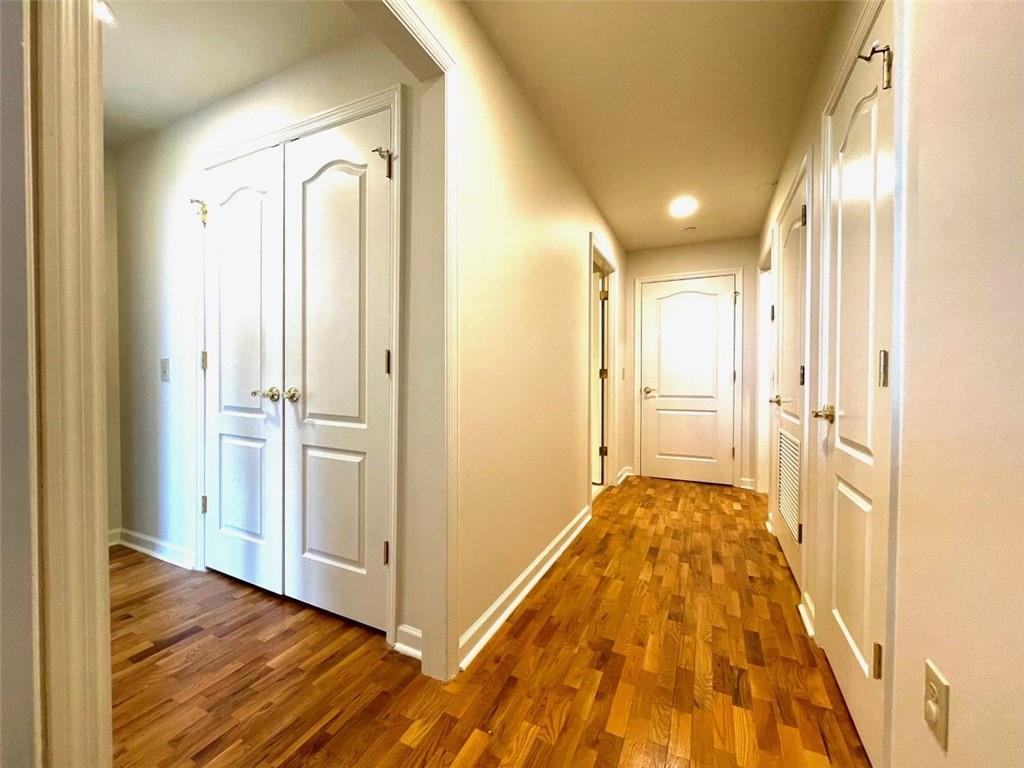 195 14th Street Northeast, Unit P603 Atlanta, GA 30309 - Photo 22 of 27 a view of a hallway with wooden floor and a bathroom