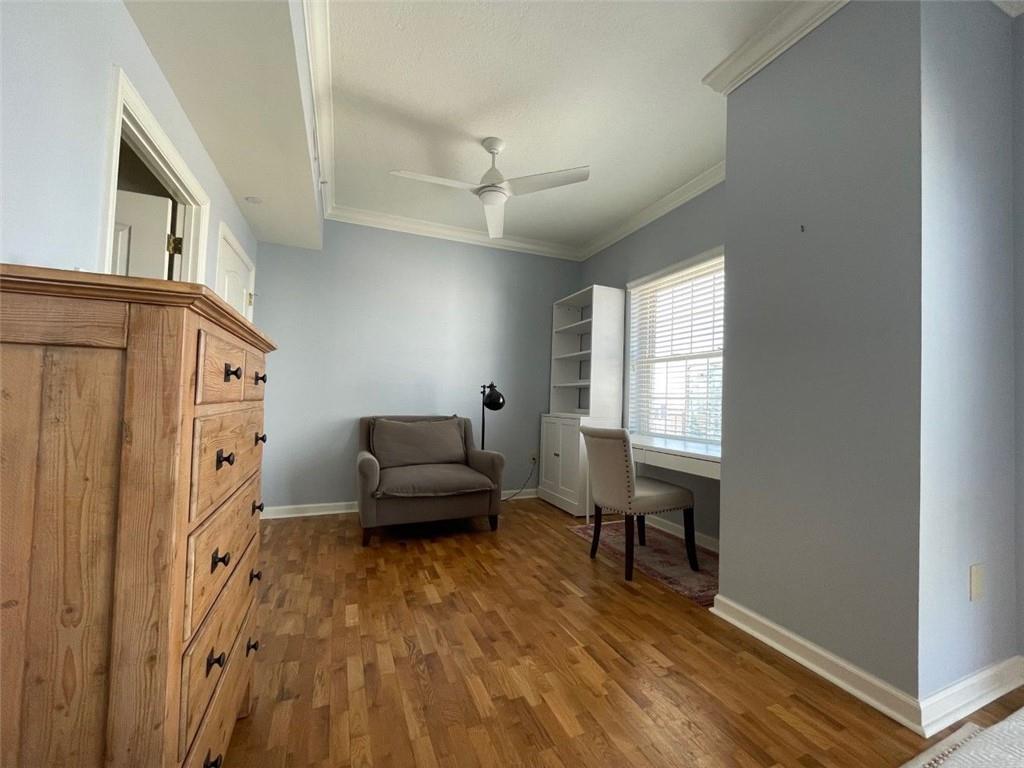 195 14th Street Northeast, Unit P603 Atlanta, GA 30309 - Photo 24 of 27 a living room with furniture and a wooden floor