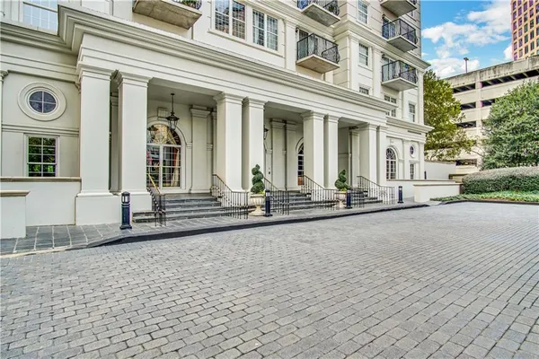 front view of a brick house with a outdoor space