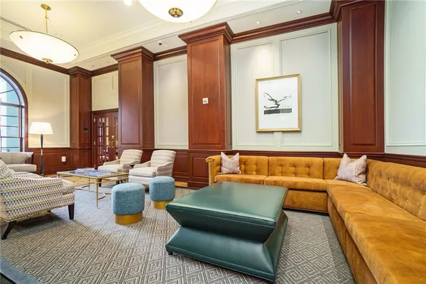 a living room with furniture and a rug