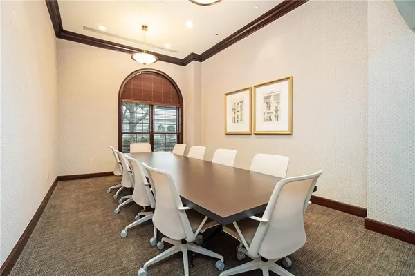 a view of a dining room with furniture and a window