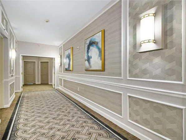 a view of a hallway with wooden floor and a fireplace