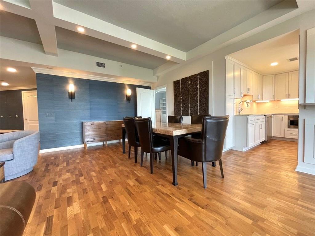 195 14th Street Northeast, Unit P603 Atlanta, GA 30309 - Photo 9 of 27 a view of a dining room with furniture and wooden floor