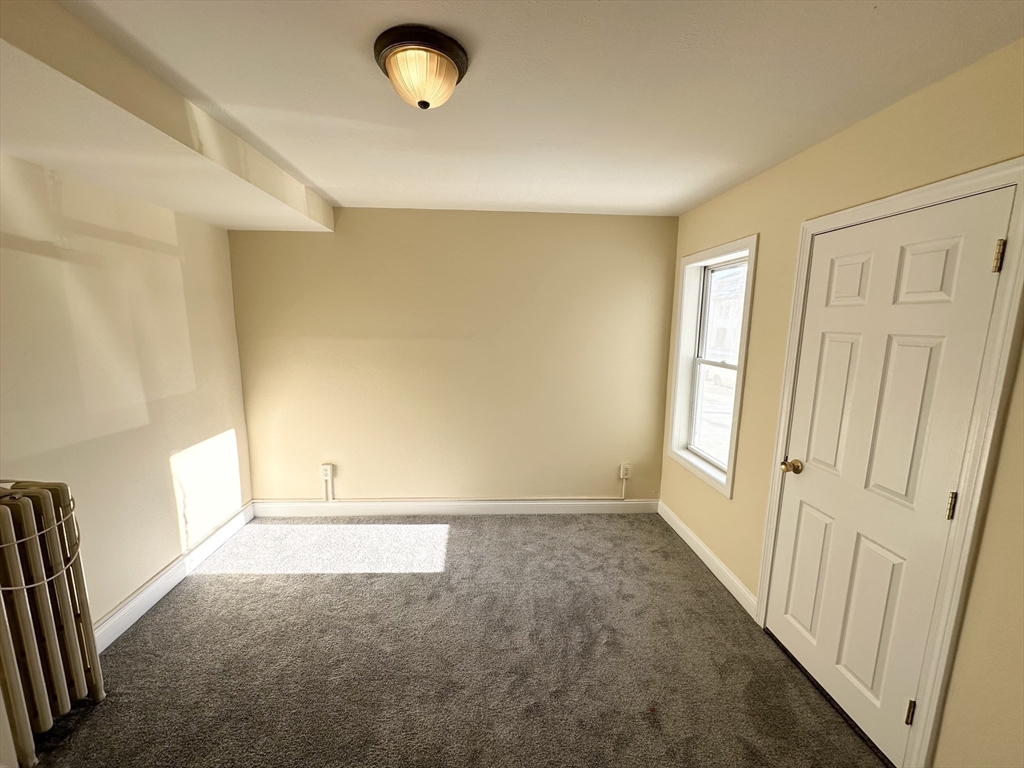 255 River Street, Unit 1 Haverhill, MA 01832 - Photo 18 of 22 an empty room with windows