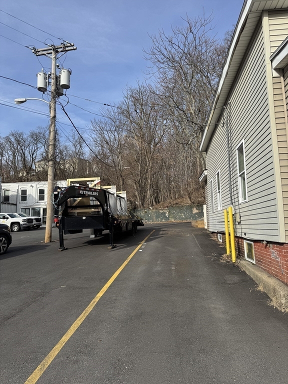 255 River Street, Unit 1 Haverhill, MA 01832 - Photo 20 of 22 a view of a city street with a car parked on the road