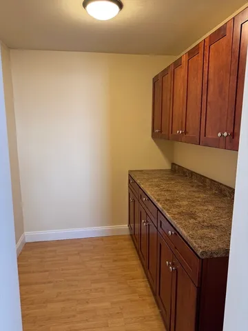 a view of a kitchen with wooden floor