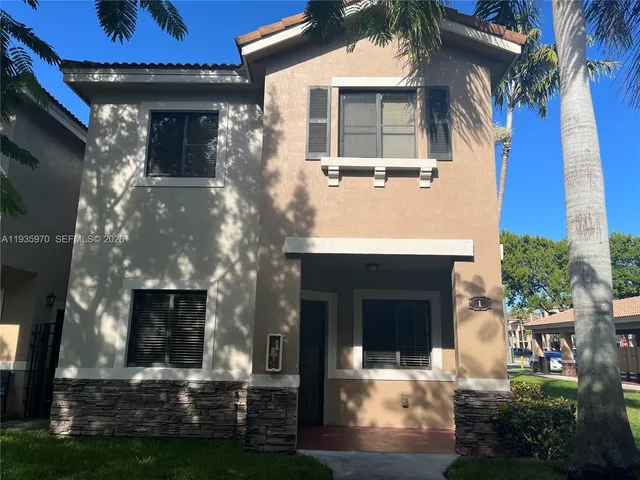 a view of house with yard