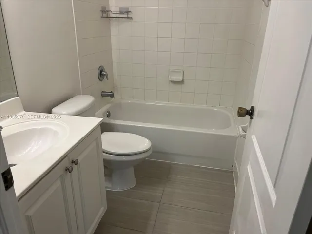 a bathroom with a sink a toilet and a bathtub