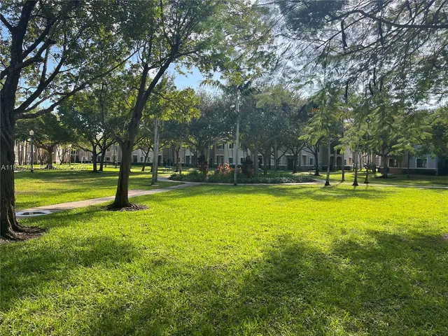 a view of swimming pool with trees