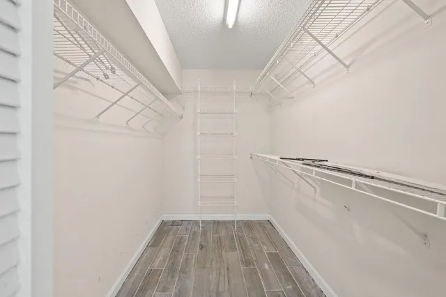 a bathroom with a double vanity sink mirror and toilet