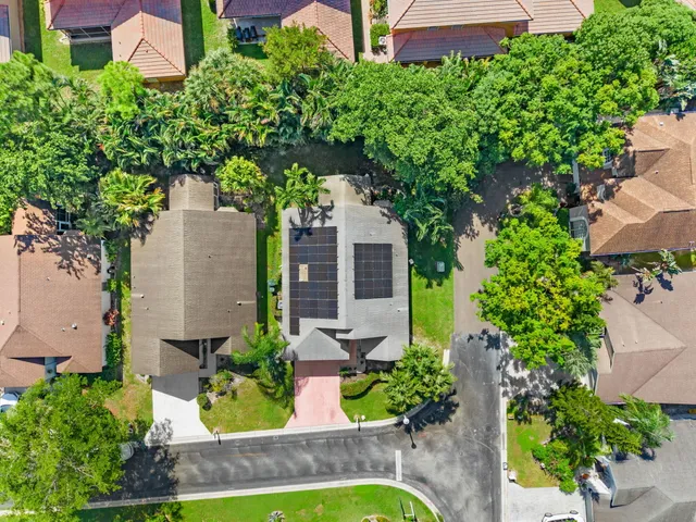 an aerial view of a house with a garden and plants