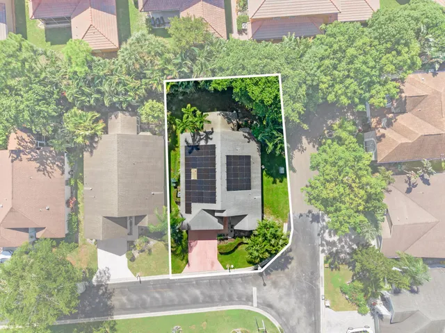 a view of outdoor space with garden and trees