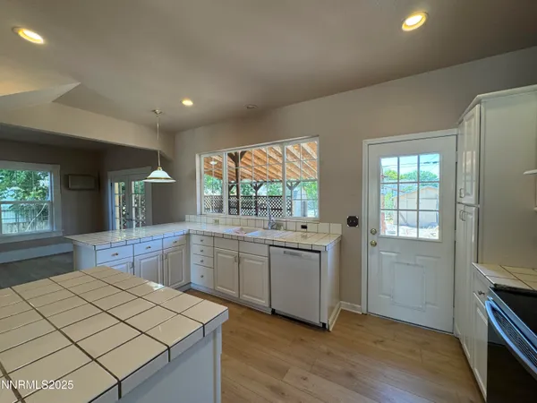 a kitchen with a sink stove and refrigerator