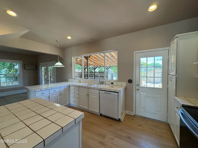 a kitchen with a sink stove and refrigerator
